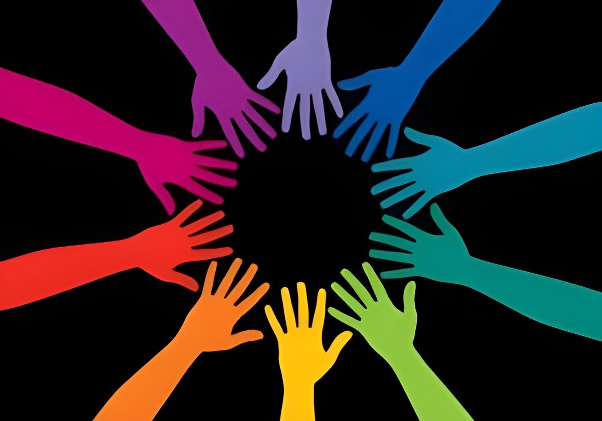 Hands of various colors reaching inward, forming a circle on black background.