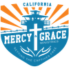 Logo for Mercy & Grace Ministries in California, featuring a guard tower and cross, with the tagline: "Setting the Captives Free."