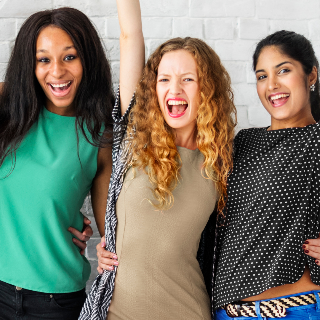 Three women are posing for a picture and one of them is screaming