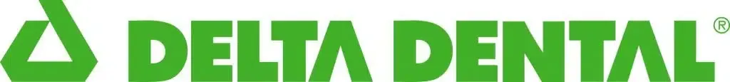a green delta dental logo on a white background .