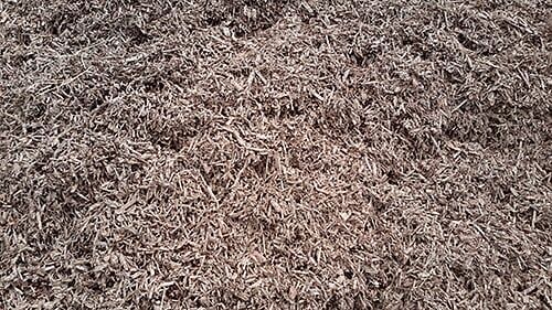 Brown shredded wood mulch.