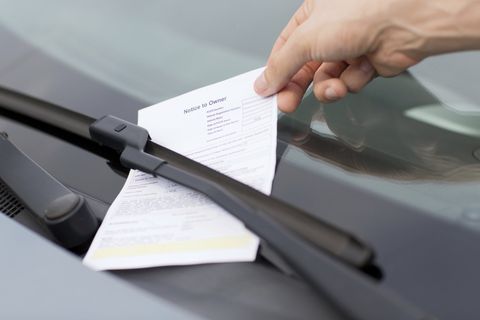 Traffic Ticket Attorney — Man Placing Ticket on The Car Windshield in Chesterfield, VA