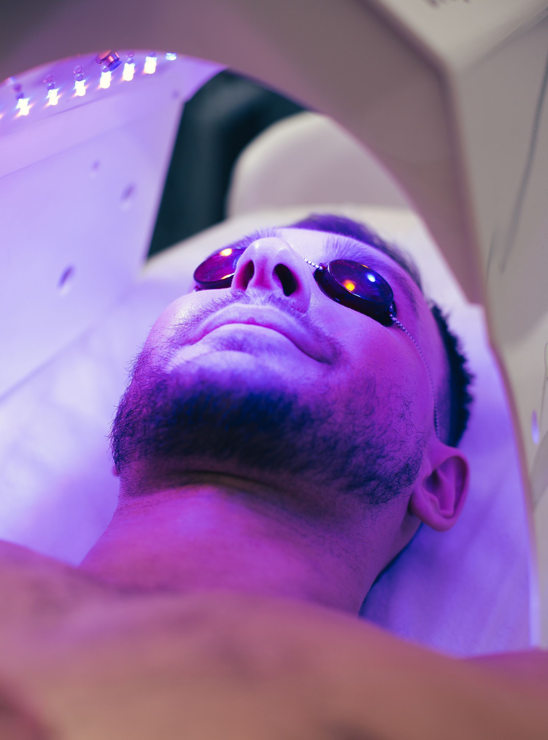 man getting light therapy
