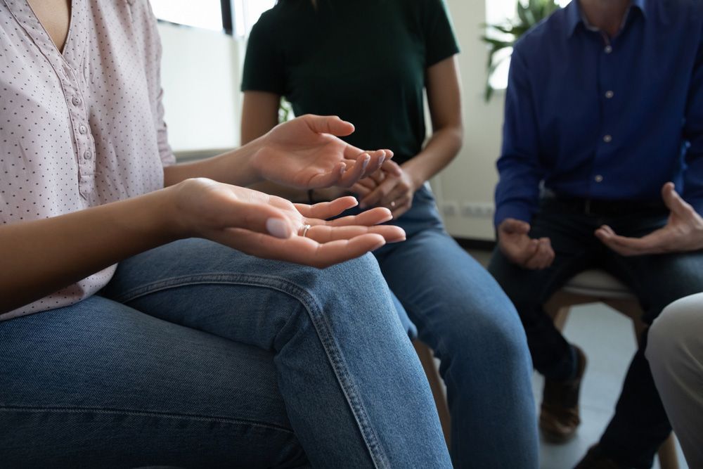 Three People Sit in a Circle — Moreton Bay Therapy in Deception Bay, QLD