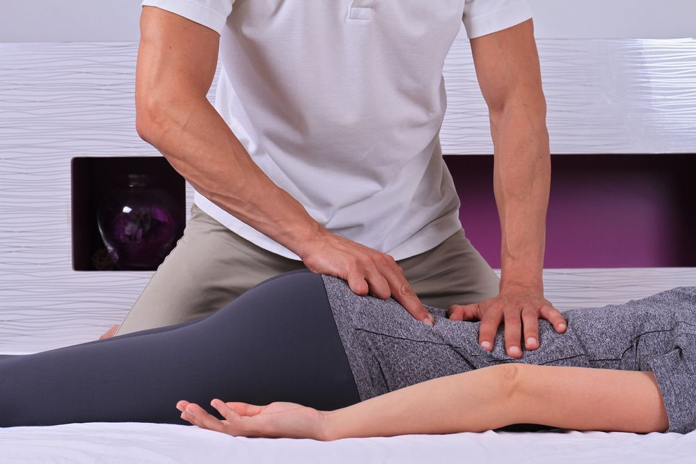A Person Performing Manual Physical Therapy — Moreton Bay Therapy in Murrumba Downs, QLD