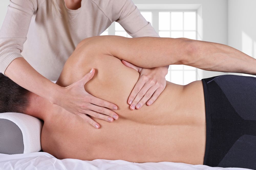 A Therapist Performing a Shoulder Massage — Moreton Bay Therapy in Kallangur, QLD