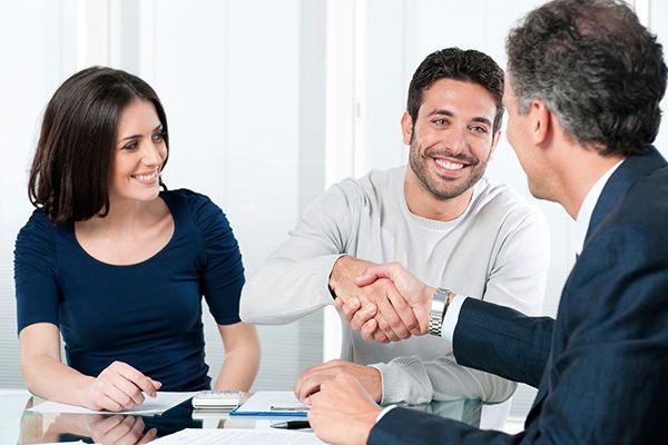 Happy Couple Seal a Deal with Their Personal Financial Advisor — Matteson, IL — RA Benefit Solutions