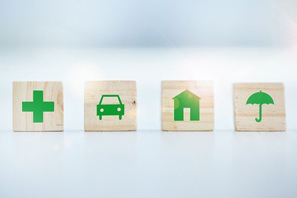 Wooden Blocks with Insurance Symbols — Matteson, IL — RA Benefit Solutions