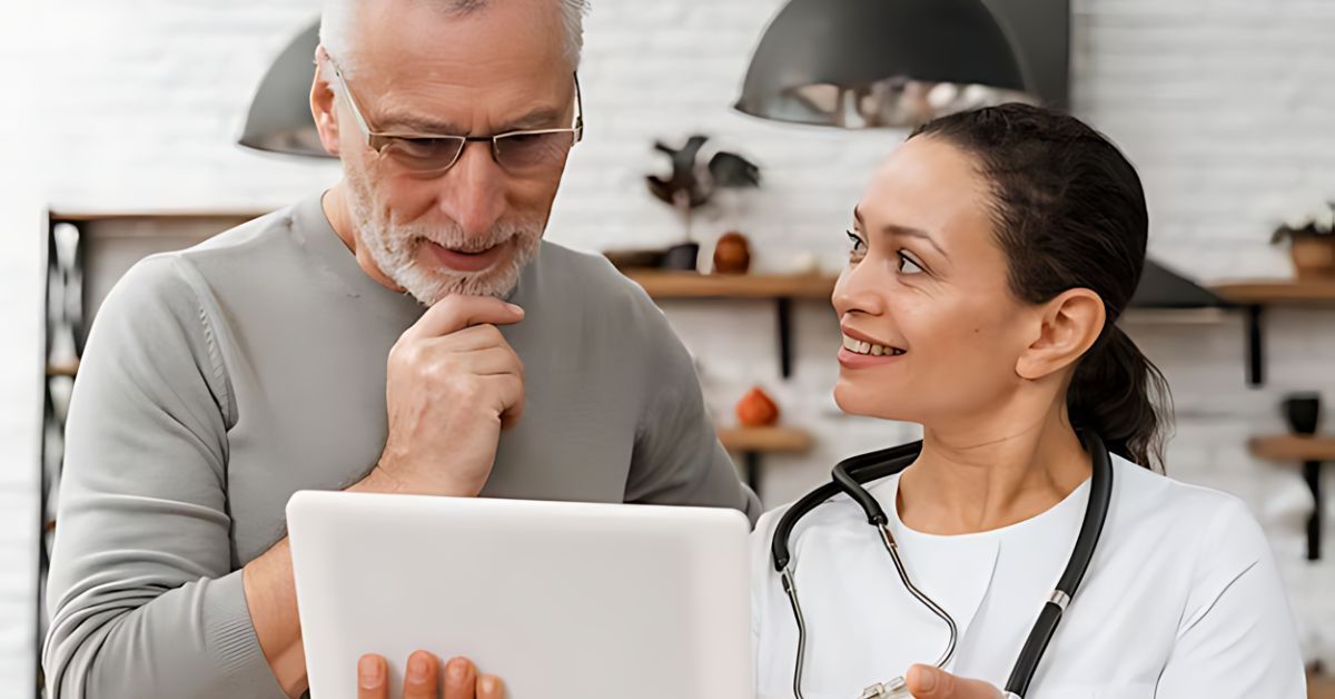 A man and his doctor reviewing paperwork.