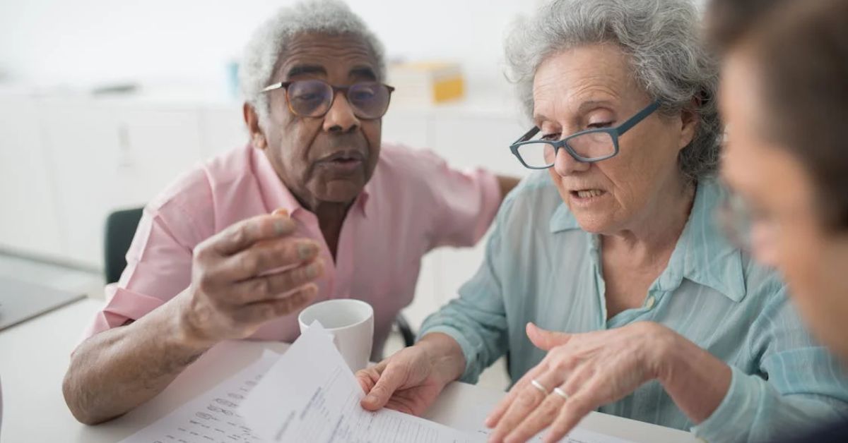 Two Seniors Looking at financial papers