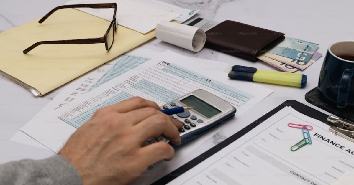 a person using a calculator on a table