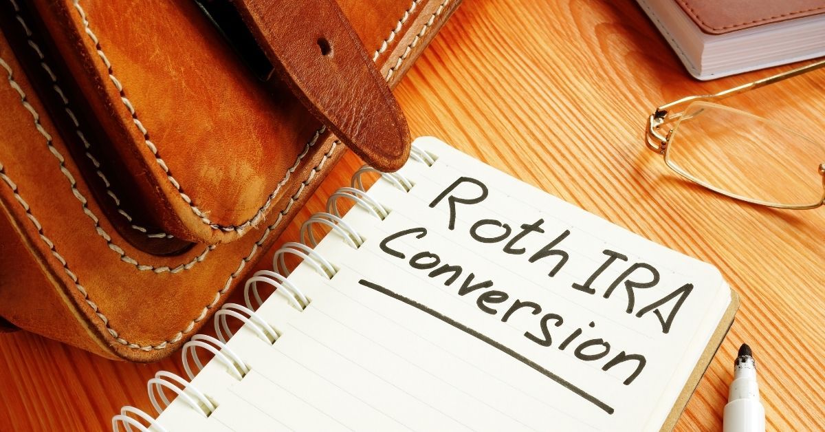 A notebook with the words roth ira conversion written on it