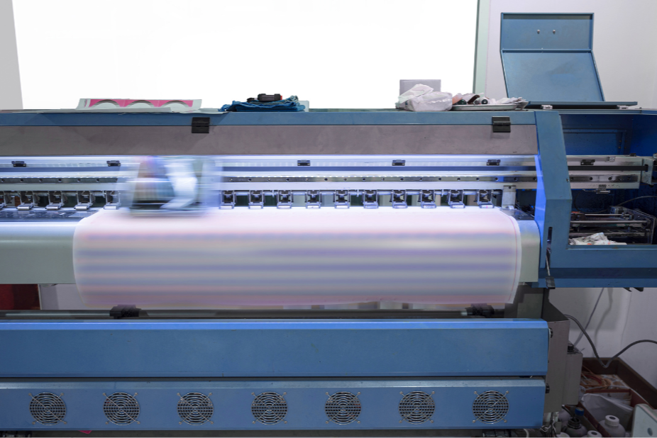 A man is wearing a white hoodie and jeans.