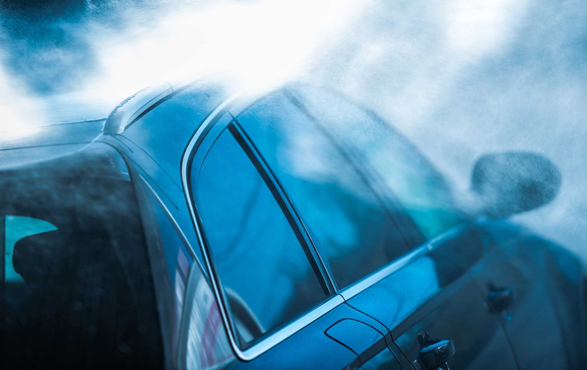 Express Automatic Car Wash Service Rinsing Car.