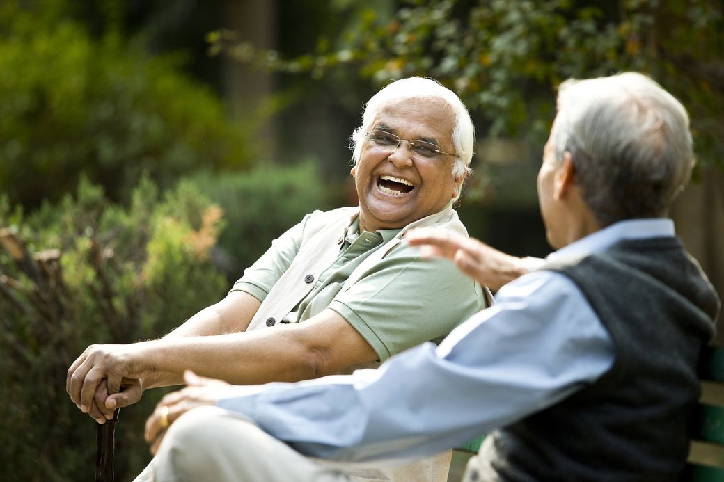 Two Senior Men Discussing on Bench – Beaver Falls, PA – Cambridge Village
