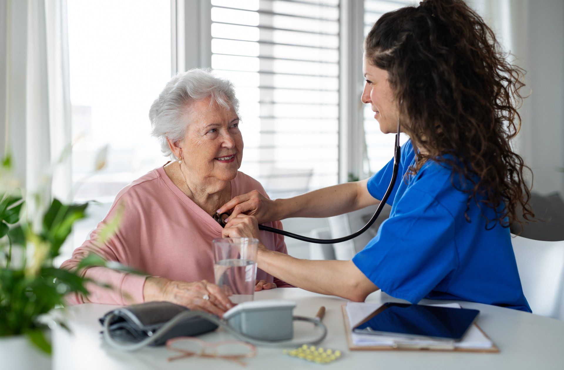 Healthcare Worker Examining Senior Woman – Beaver Falls, PA – Cambridge Village