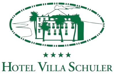 Green Hotel Villa Schuler logo with stylized building and palm trees in an oval frame