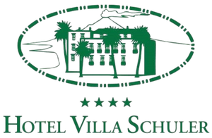 Green Hotel Villa Schuler logo with stylized building and palm trees in an oval frame