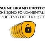 Scudi dorati, uno con l'icona di un lucchetto, con testo in italiano sulla protezione del marchio per gli hotel.