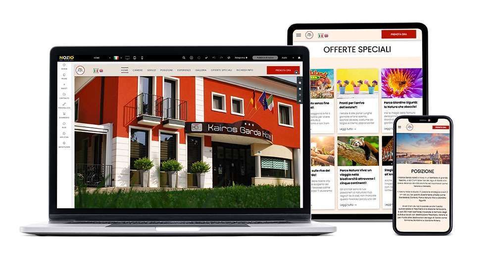 Computer portatile, tablet e telefono che mostrano il sito web di un hotel, un edificio rosso e offerte speciali.