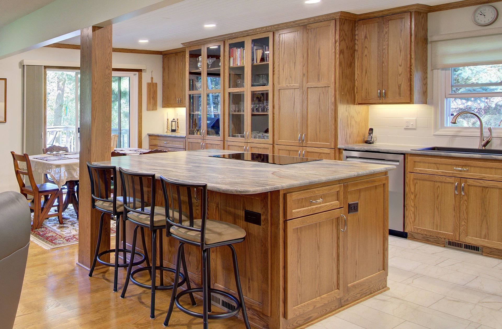 A kitchen with wooden cabinets and granite counter tops