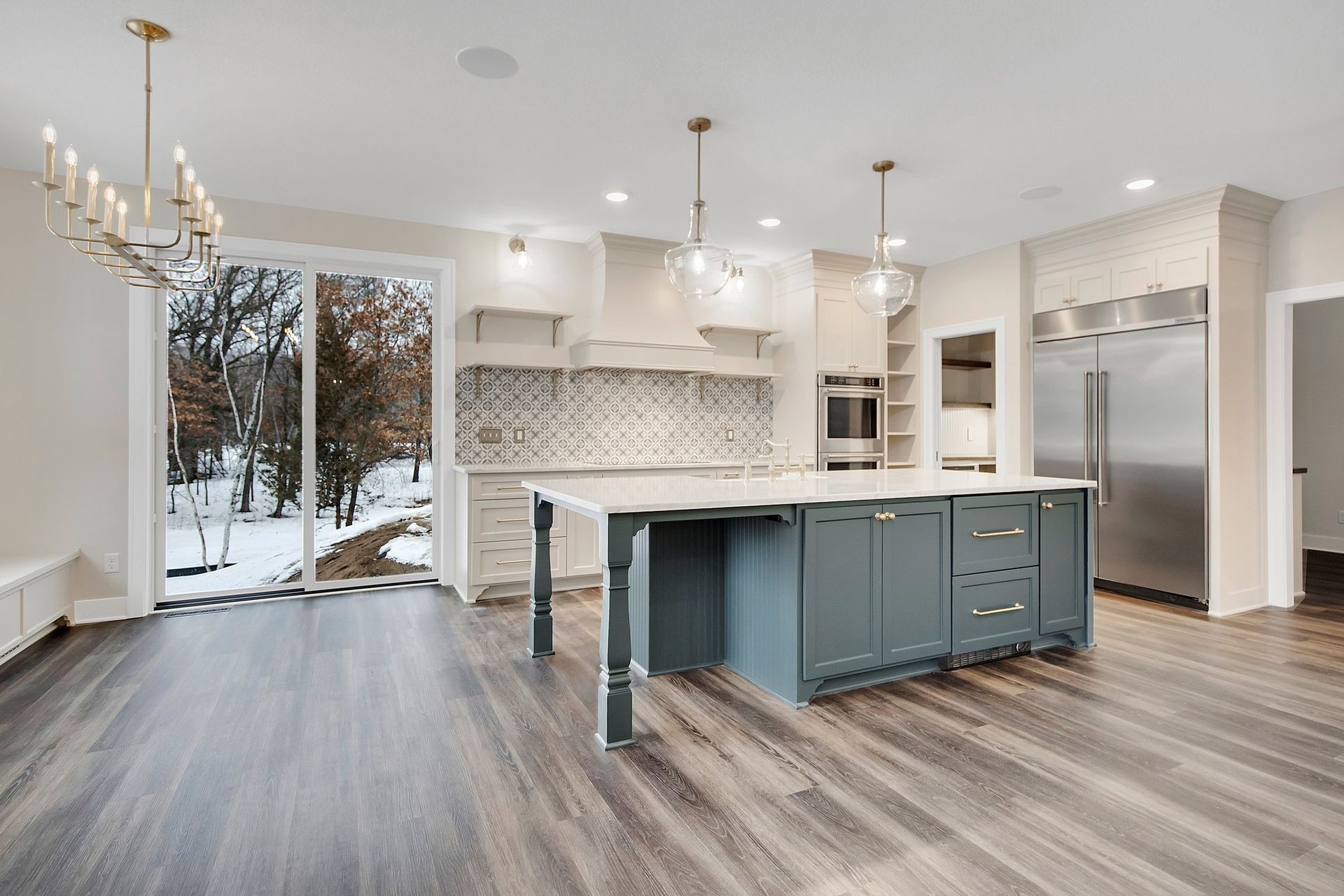 There is a large island in the middle of the kitchen.