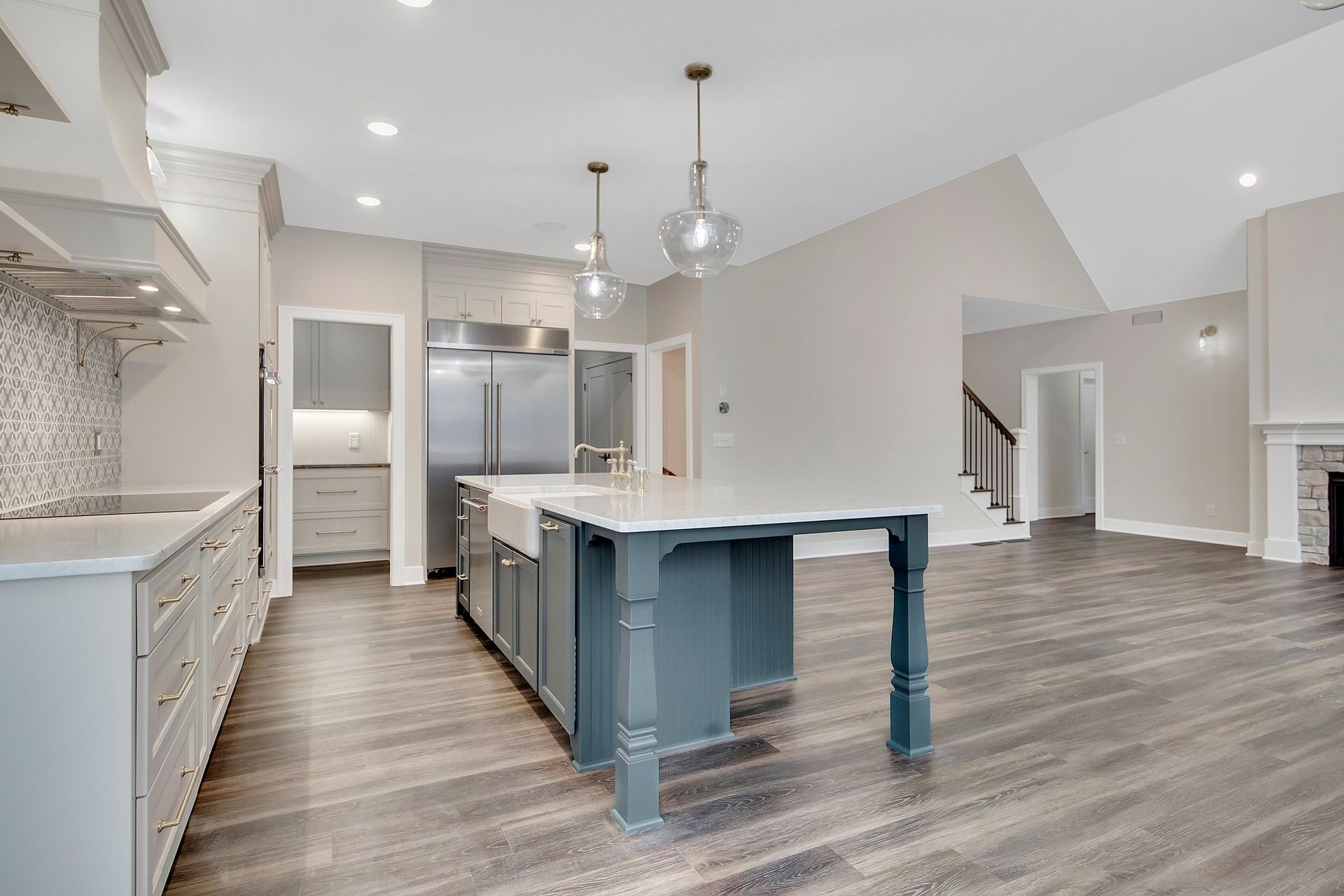 There is a large island in the middle of the kitchen.
