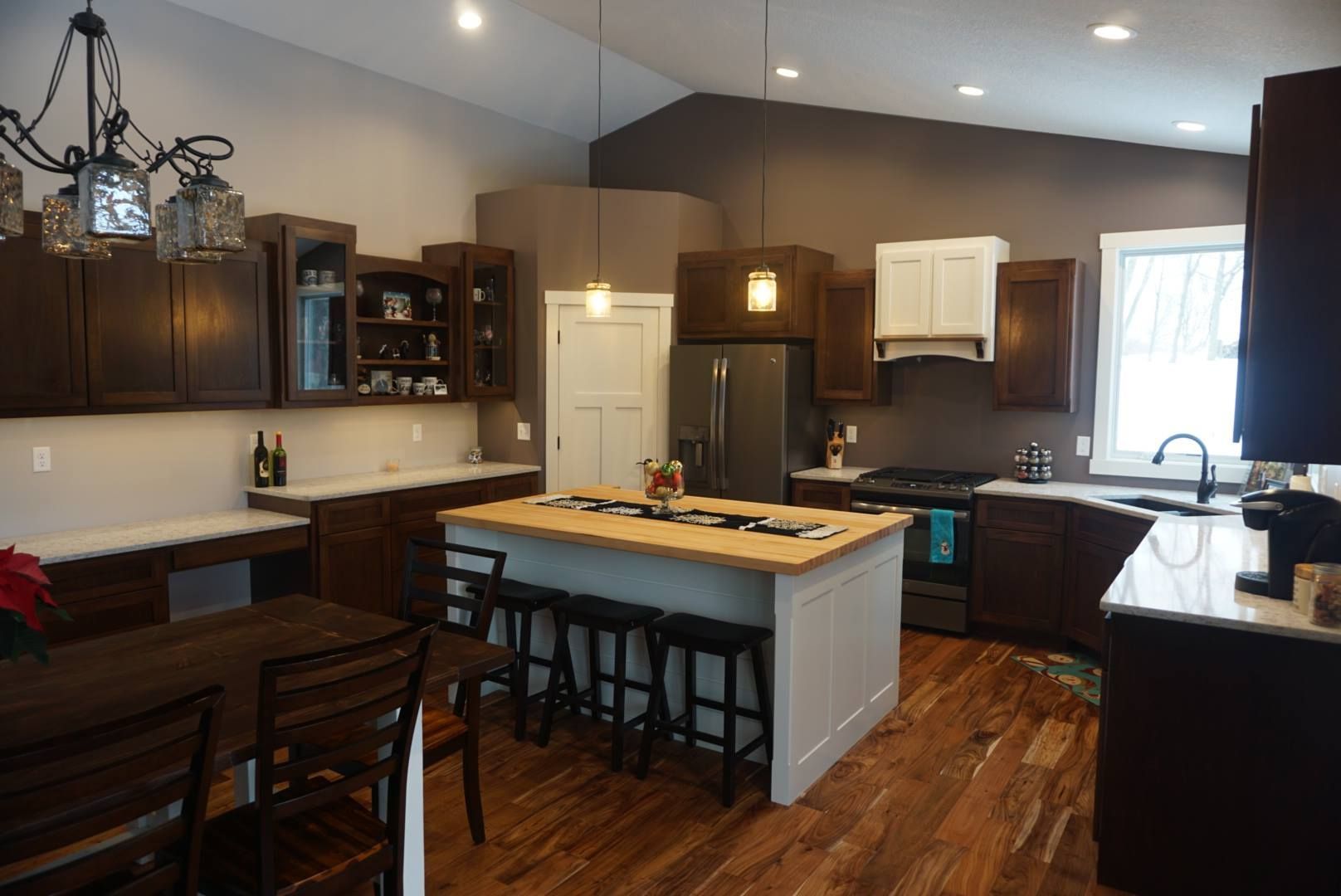 A kitchen with a large island in the middle of it