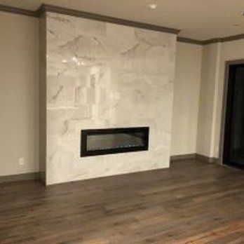 There is a fireplace in the middle of the room.