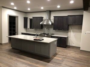 There is a large island in the middle of the kitchen.