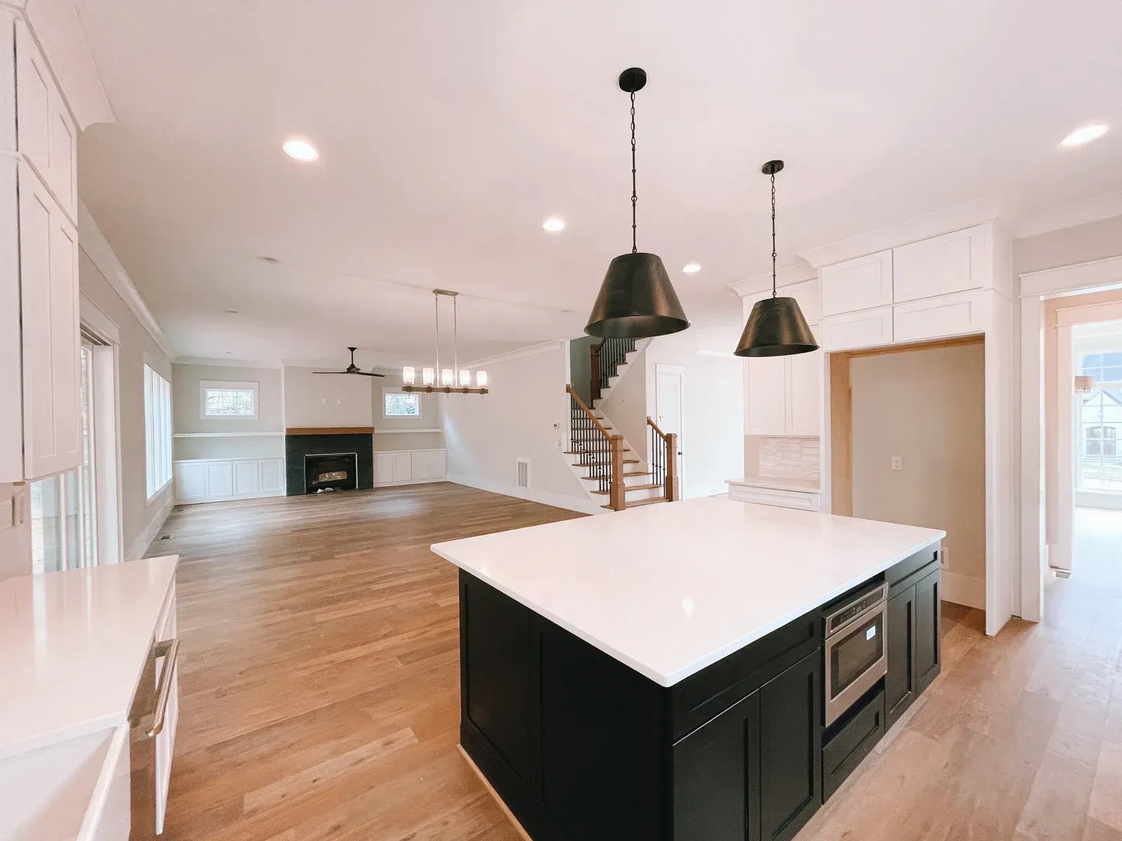 There is a large island in the middle of the kitchen.