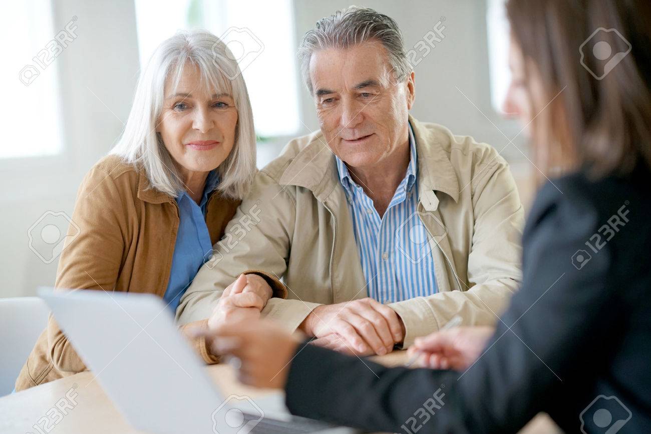 senior couple meeting with investor