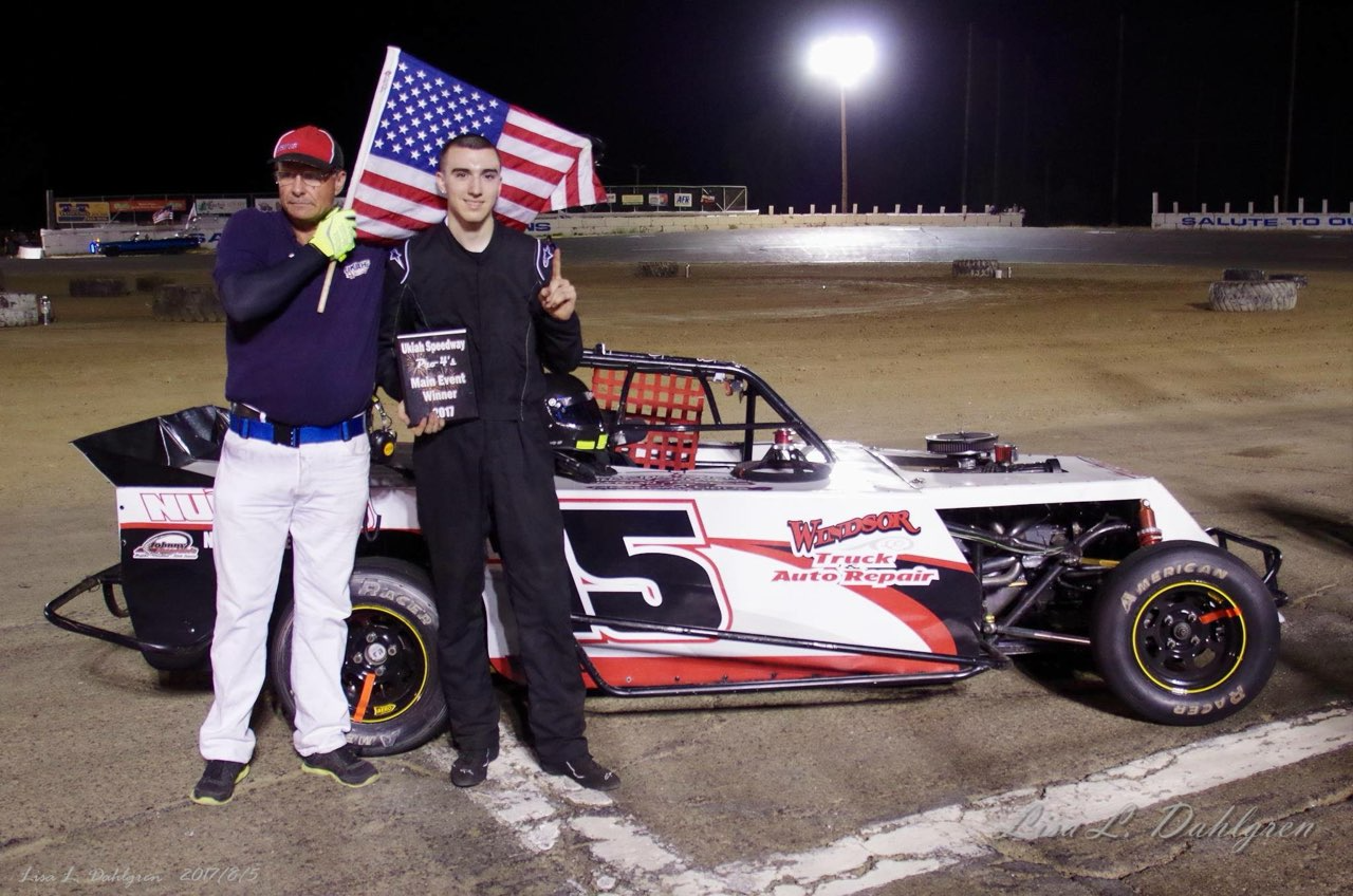 race car driver with american flag | Windsor Truck and Auto