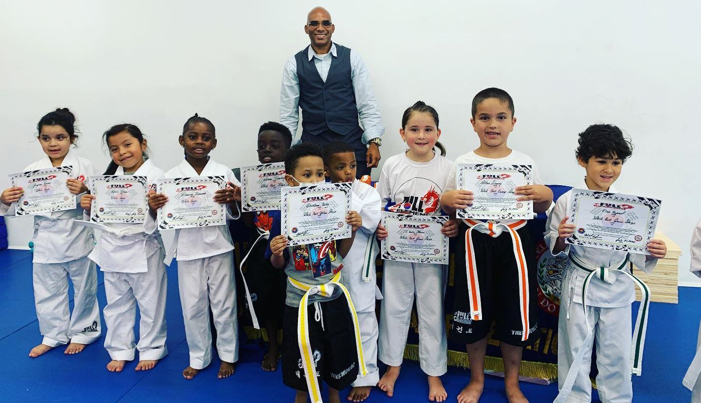 a group of kids holding up certificates that say zebra