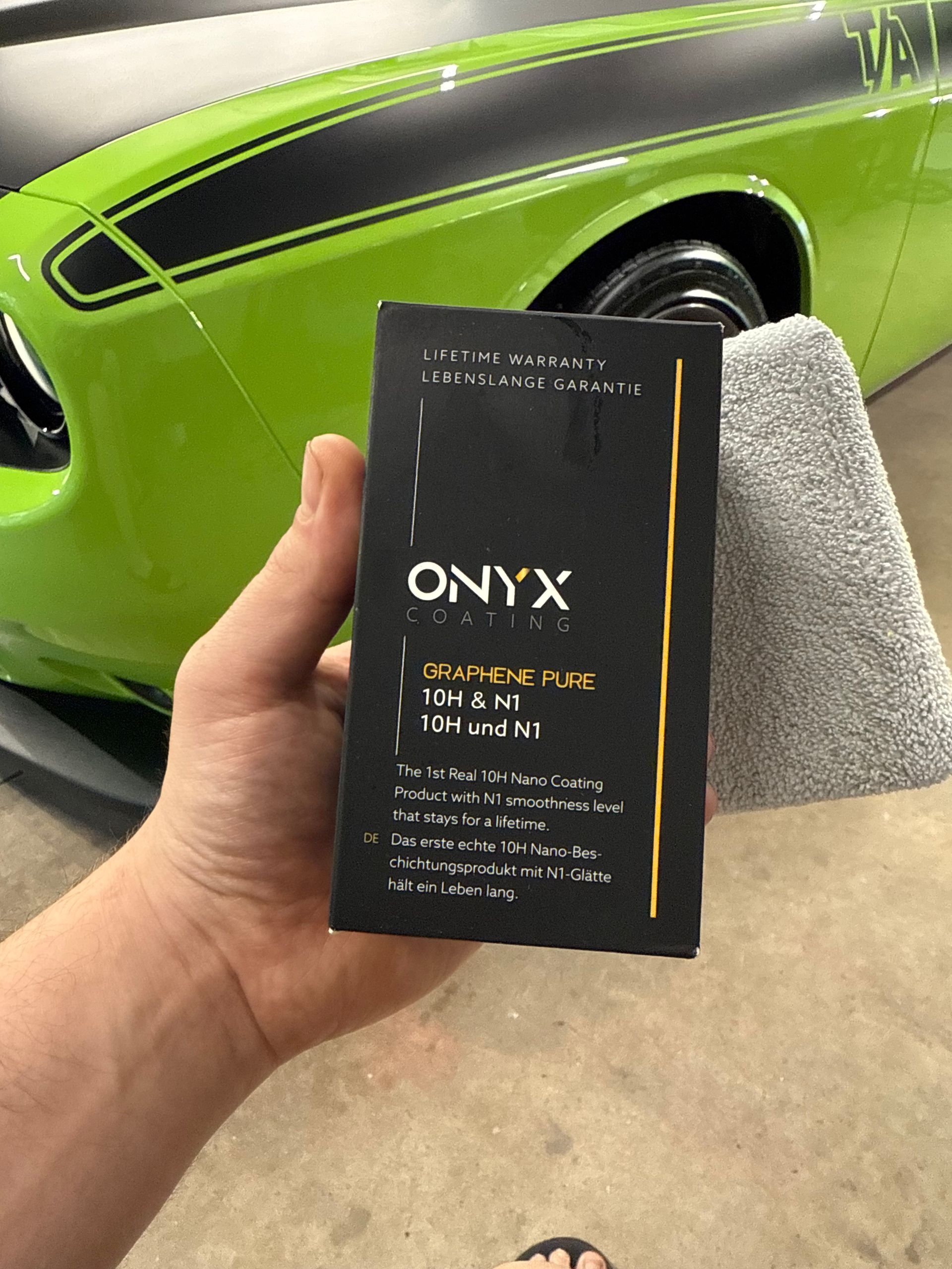 A close up of water drops on a black surface