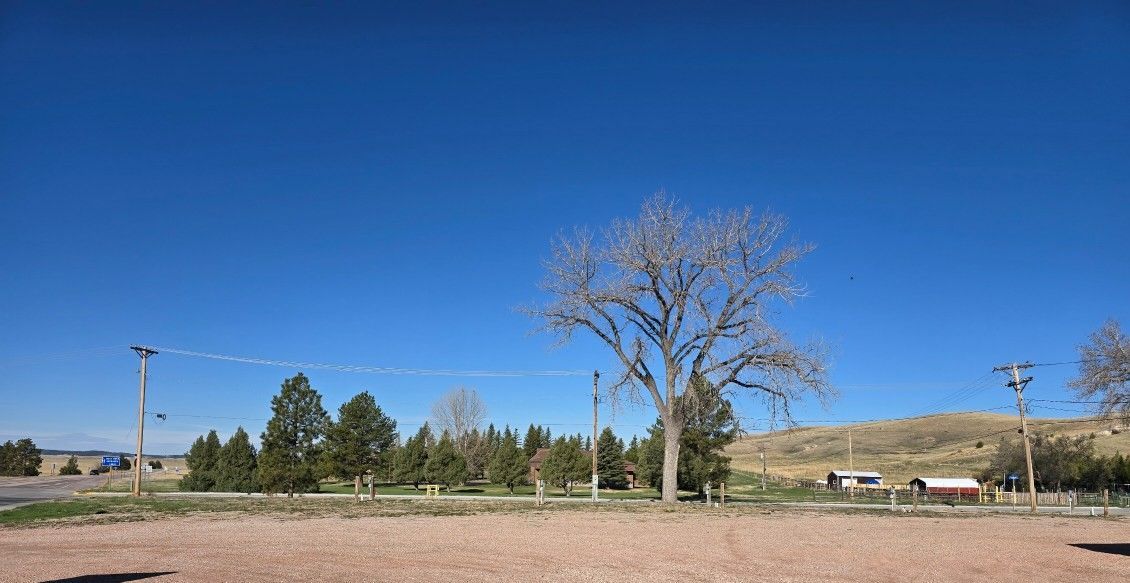 A gravel lot with rv full hookups.