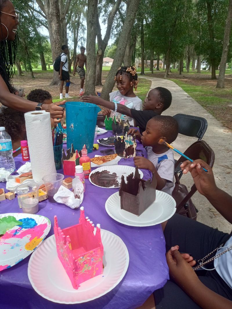 A person in a dark suit looking at glowing data charts and technical information displayed on multiple computer monitors.