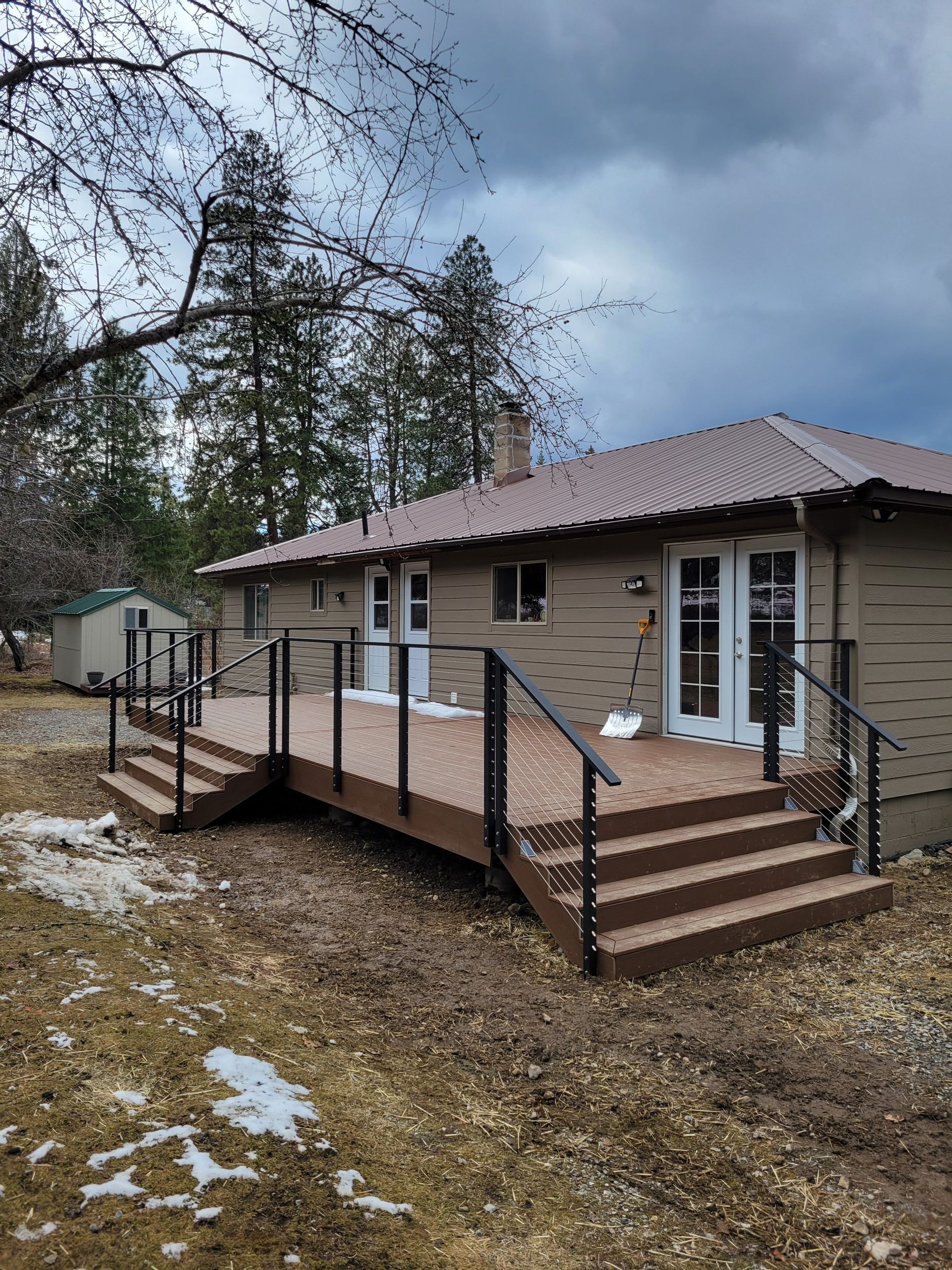 A dining room with a table and chairs and a bench.