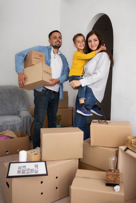 a family is moving into a new home and holding boxes