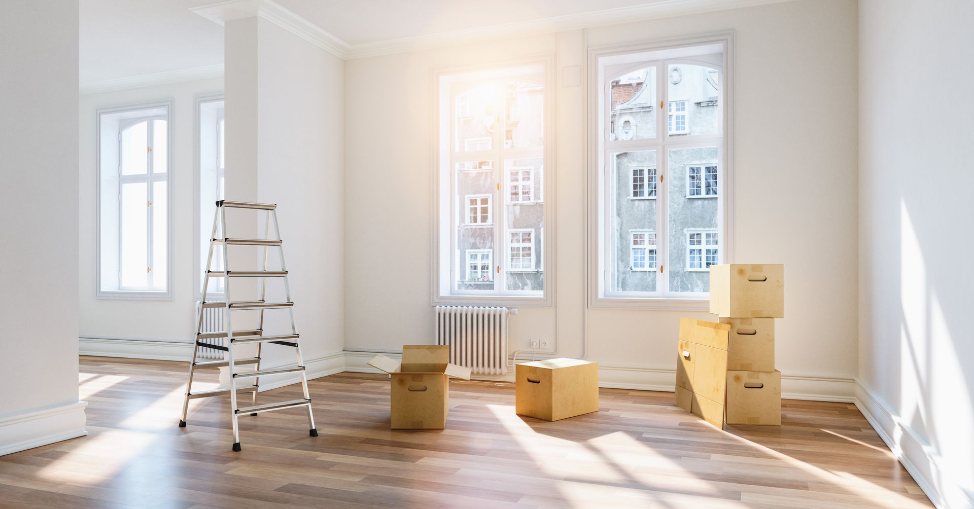 an empty apartment room with boxes