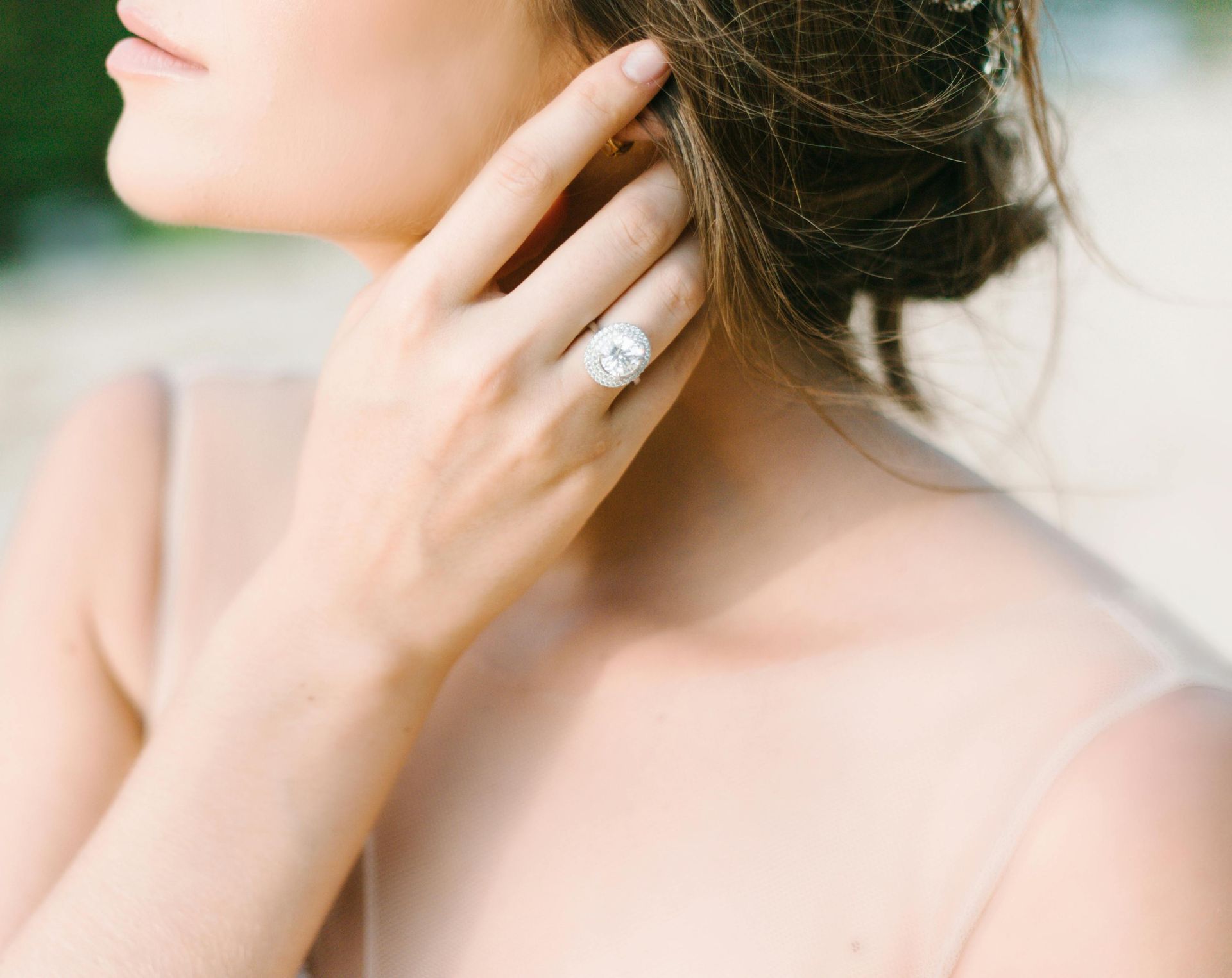 A woman wearing a wedding ring on her finger