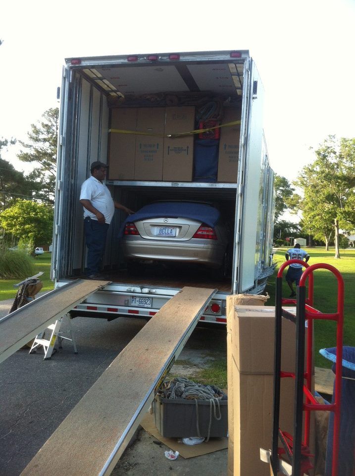 Man Moving the Car Inside the Truck — Moving Company in Troutman, NC