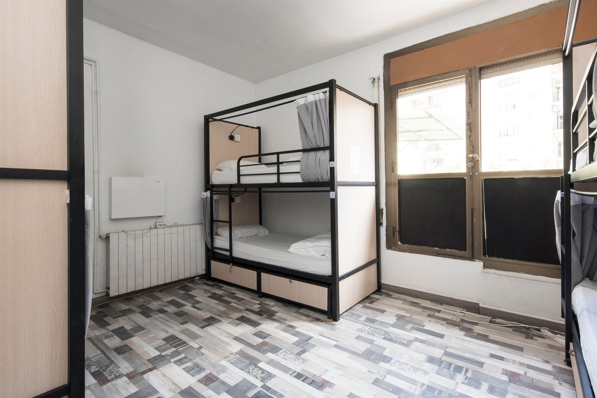 There is a bunk bed in the middle of the room.