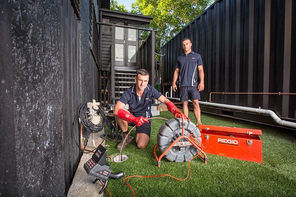 Plumbers Working on a Clogged Drain — Unblock Pipe Clearing in Byron Bay, NSW