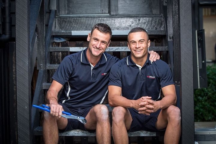 Two Plumbers Sitting on Staircase — Unblock Pipe Clearing in the Mullumbimby, NSW