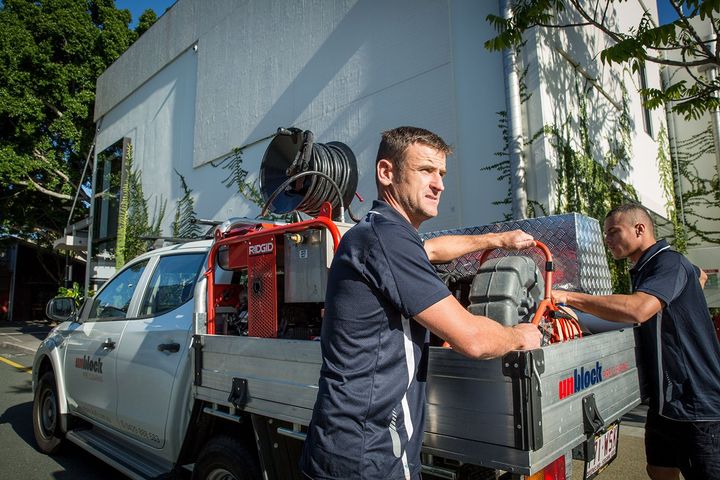 Plumbers Getting Equipment From Their Ute — Unblock Pipe Clearing in Mullumbimby, NSW