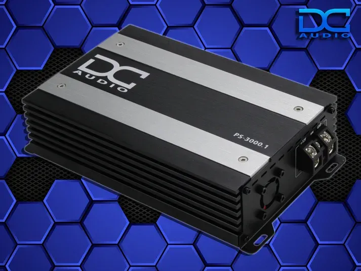 DC Audio car audio amplifier on a blue geometric background.