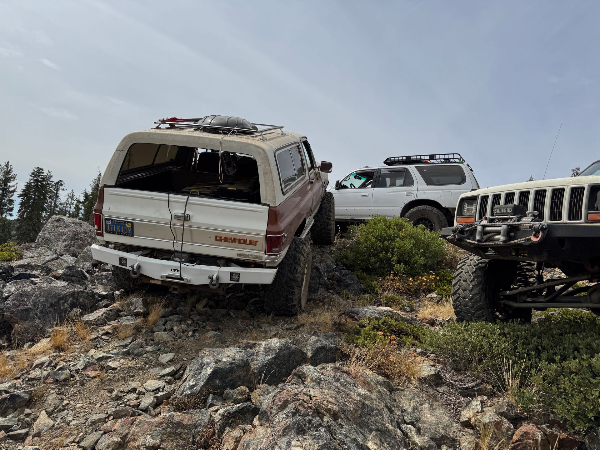 Silver truck rear bumper, with mounting brackets and receiver.