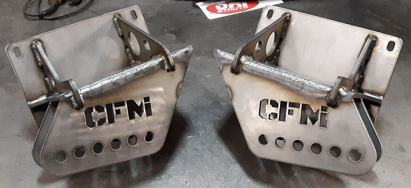 Two stainless steel mounting brackets with CFM cutouts and bolt-on hardware.