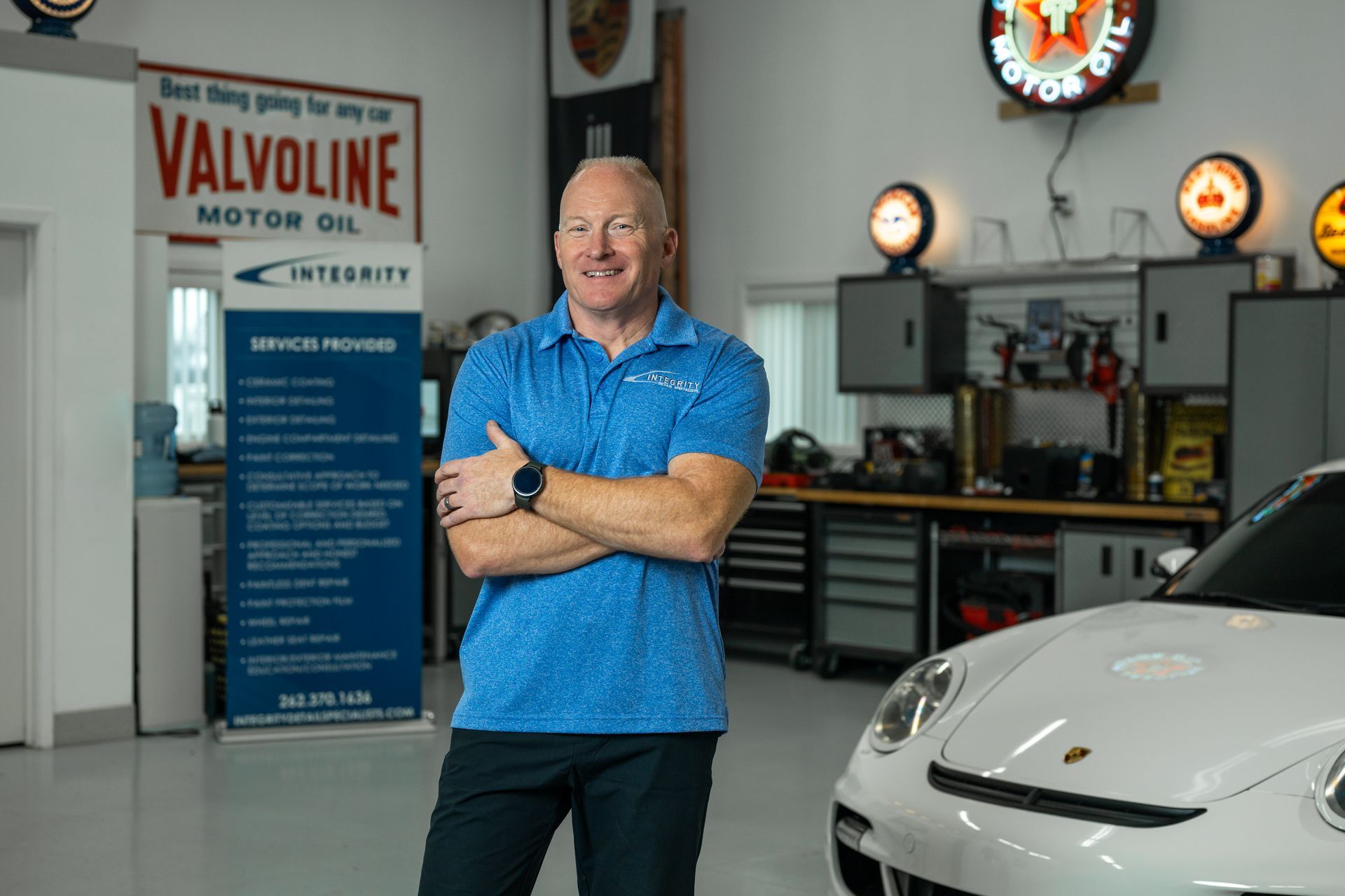 a person is cleaning the inside of a car with a vacuum cleaner .